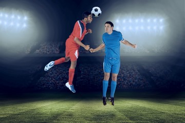 Fototapeta na wymiar Composite image of football players tackling for the ball