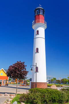 White lighthouse over blue sky