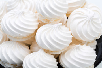 French vanilla meringue cookies on white background