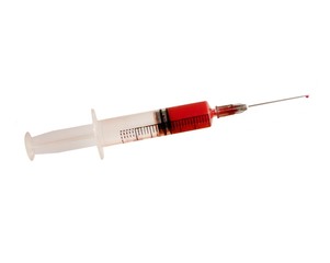 Fototapeta premium Syringe with medicine isolated on white background