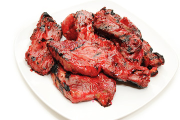 Chinese Stickt Barbeque Spareribs on a White Plate