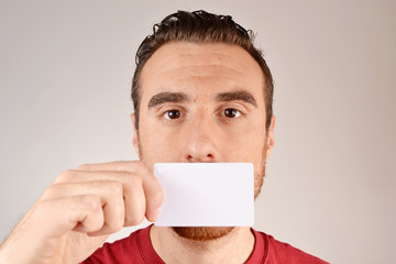Young man with his mouth covered