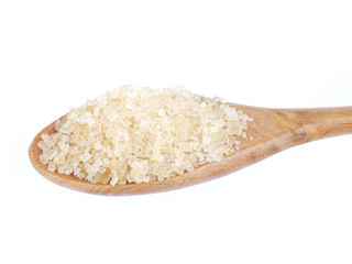 granulated sugar in spoon isolated on white background