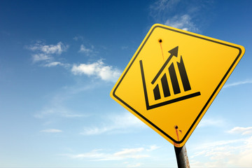 Stock exchange ahead. Yellow traffic sign.