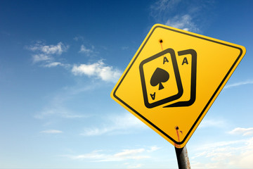 Gambling zone ahead. Yellow traffic sign.