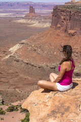Girl sitting at the edge of the Canyon