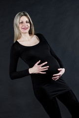 portrait of pregnant woman wearing black clothes