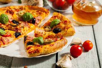 Pizza with bacon, olives and jalapeno pepper