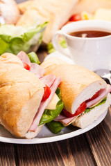 Panini sandwich with ham, cheese and tomato