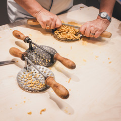 Preparation of passatelli fresh pasta using traditional tool