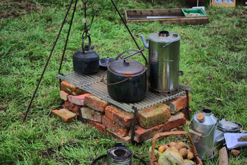 Old fashioned pots and pans on a fire