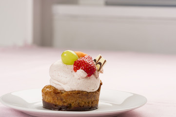 Tasty gourmet dessert with fresh fruit topping