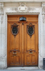 Ornate carved wooden door in Paris, France
