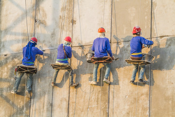 Bricklayer working on the high building