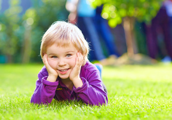 portrait of cute kid on summer grass