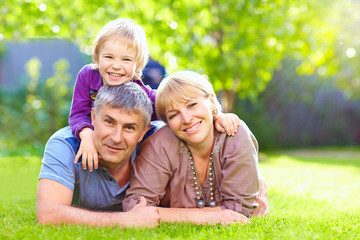 happy family together in summer park