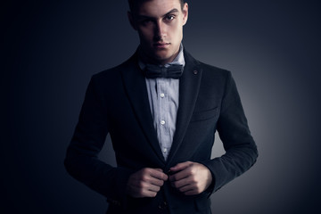 Portrait of attractive handsome stylish fashion young man in