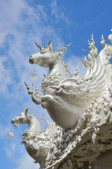 Fototapeta premium CHIANG RAI, THAILAND - NOVEMBER 21 : Wat Rong Khun buildings and