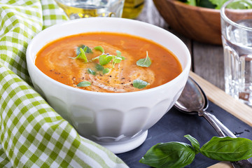 Tomato soup in white bowl
