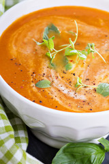 Tomato soup in white bowl