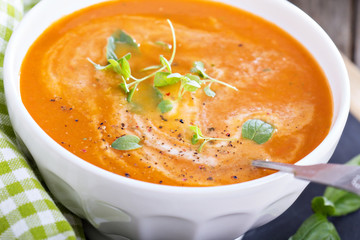 Tomato soup in white bowl