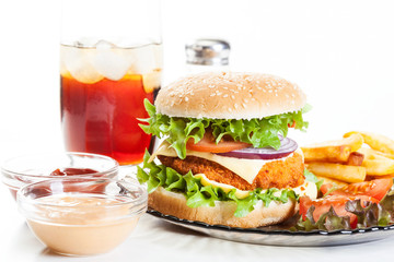 Chickenburger and glass of cola with ice