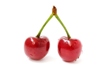 Two cherries with droplets