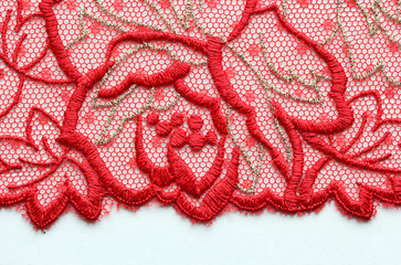 Red flower lace material texture macro shot
