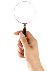 Hand holding magnifying glass isolated on white background