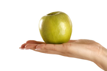 Green apple in a female beautiful hand