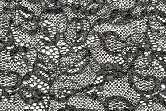 Black mesh lace material texture macro shot