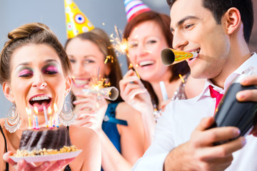 Friends having  birthday celebration