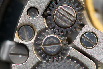 Background with metal cogwheels a clockwork. Macro, extreme clos