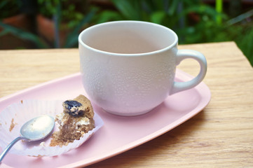 Eating cake with tea in garden