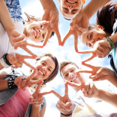 group of teenagers showing finger five