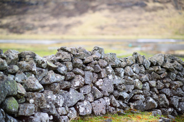 Beautiful green meadow with a old Stone wall