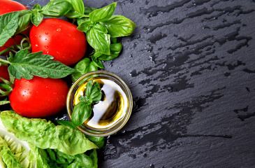 fresh basil herbs and tomatoes with olive oil