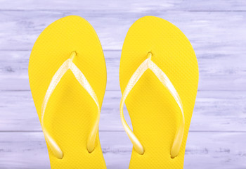 Bright flip-flops, on wooden background