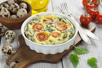 Quail eggs scrambled with nettle and cherry tomatoes