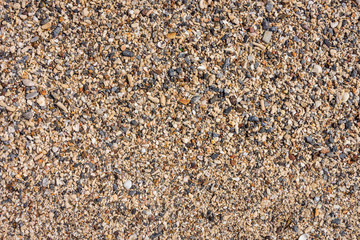 Pebbles on sand beach