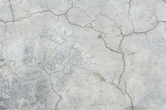 Old grunge crack grey concrete wall texture background.