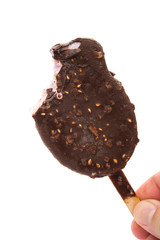 hand holding a chocolate ice cream with a bite