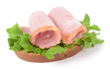 Delicious sandwich with lettuce and ham isolated on white