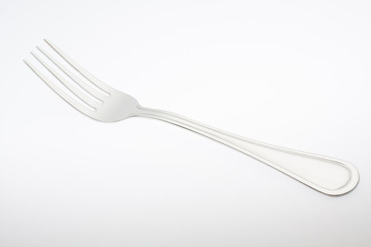 a silver fork  isolated on gray background