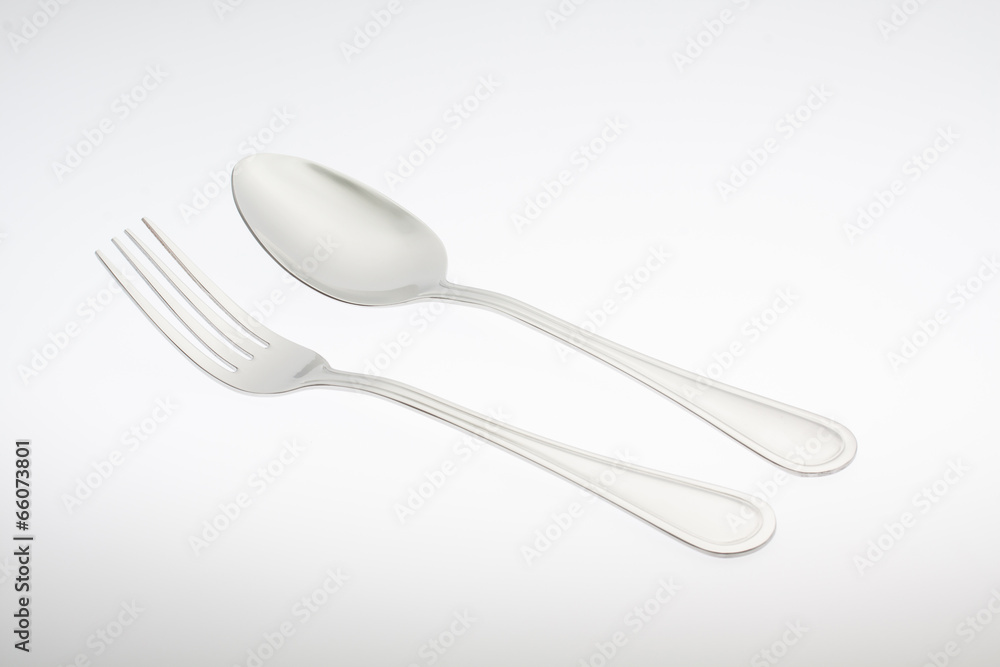 Wall mural a silver fork with spoon isolated on white background