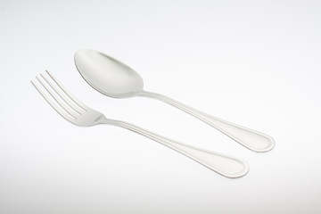 a silver fork with spoon isolated on white background