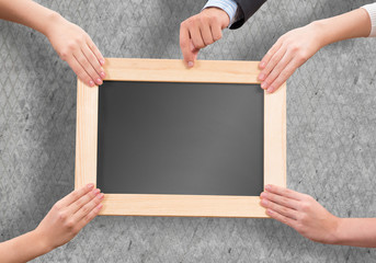 Hands holding frame