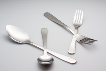 silver fork with spoon isolated on gray background
