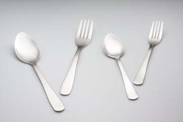 silver fork with spoon isolated on gray background