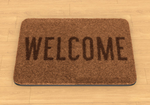 Welcome Mat On Wooden Floor